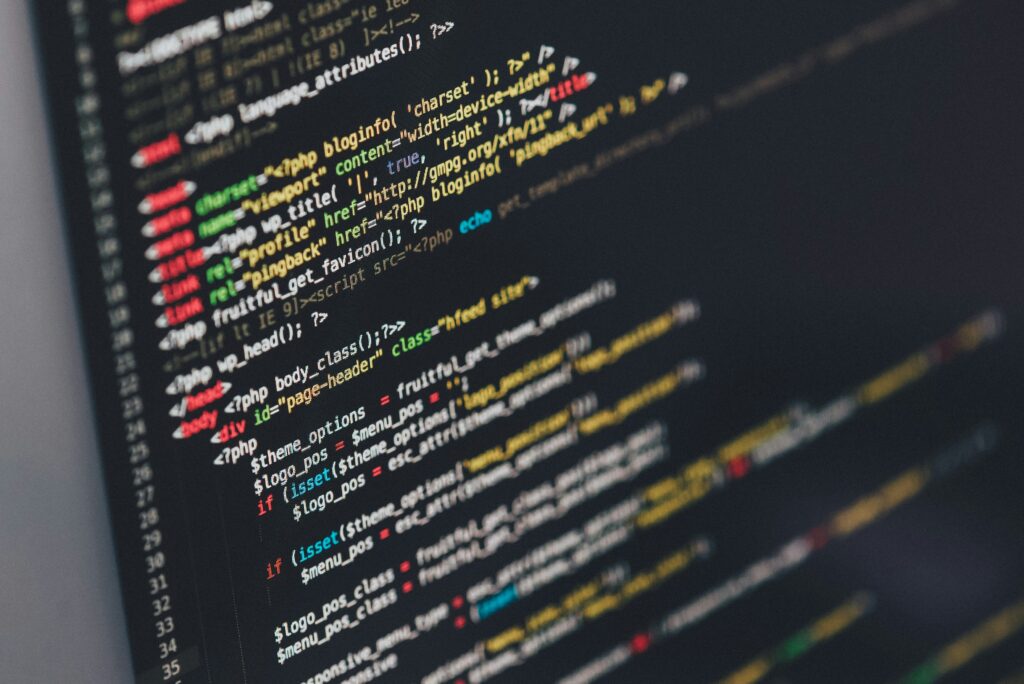 Clean code on a monitor in a soft-lit room — public repos and practice work