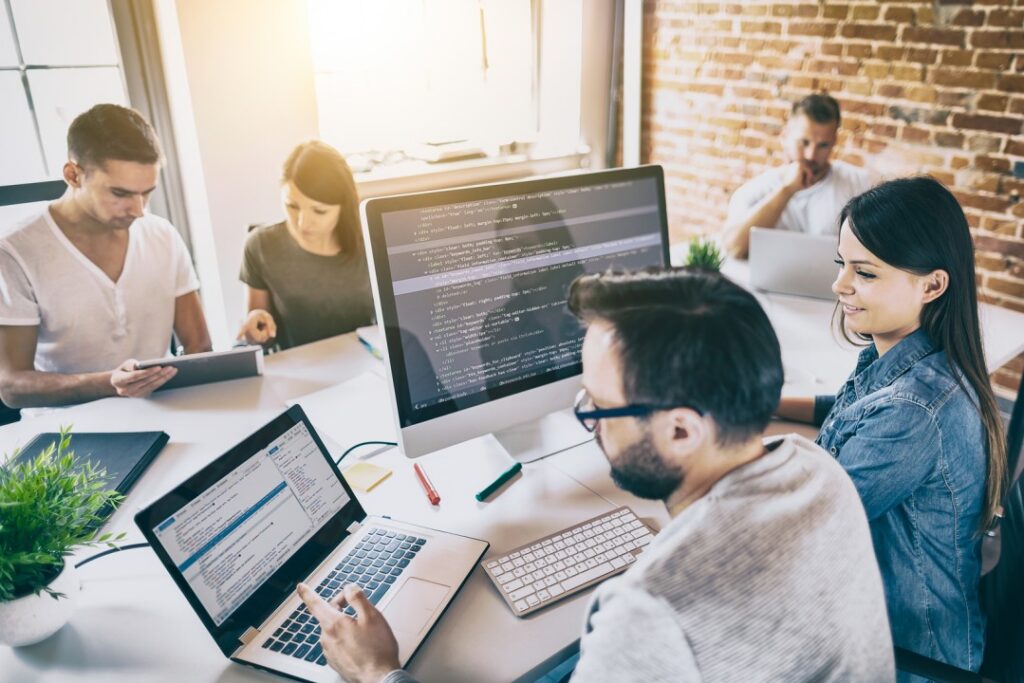 wordpress agency overflow multiple people looking at computer monitors